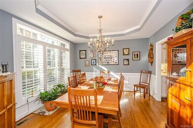 Dining room with picture frame wainscoting and cro