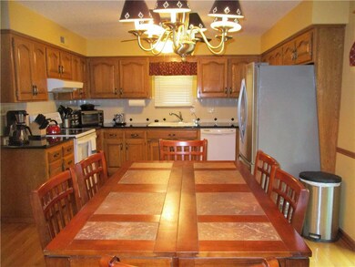The dining area in the kitchen/dining combo has pl