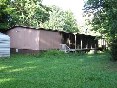 Take a look at the covered porch on the back of the house.A great place to set in the late afternoon and watch the kids play or the wild life coming out to graze on the grass.