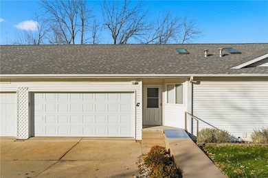 Entrance featuring ramp and railing