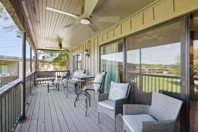 Wooden deck featuring an outdoor hangout area and 