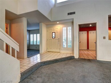 Entry foyer, den on the left