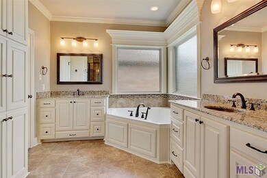 Spacious master bathroom with slab granite double 