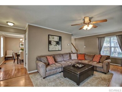Bright & Open Living Room with crown moldings and 