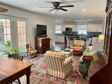 Living room with hardwood / wood-style floors, ple