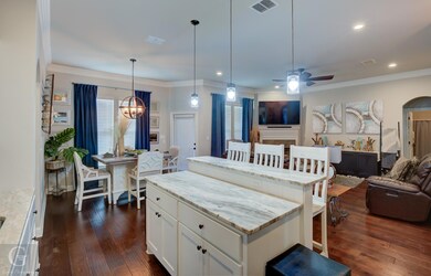 Kitchen with ceiling fan, decorative light fixture