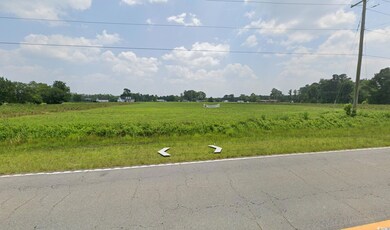 View of yard with a rural view