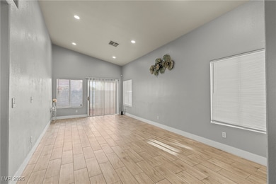 Spare room featuring light wood-style floors, base