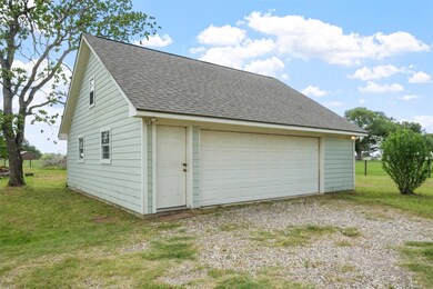The detached two-car garage provides ample parking