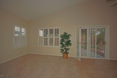 Family room with plantation shutters.