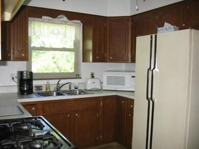 The wood cabinets were custom-made.  The back wall