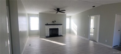 Unfurnished living room with a textured ceiling, a
