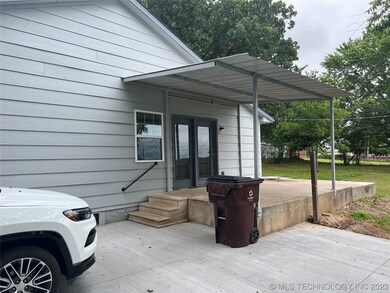 Side with covered porch
