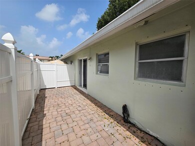 Back patio is fenced and offers sliders to area fo