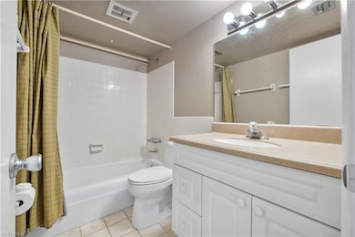 Full bath with vanity, visible vents, toilet, show