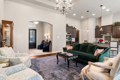 The pretty entry is framed with a wide arched door