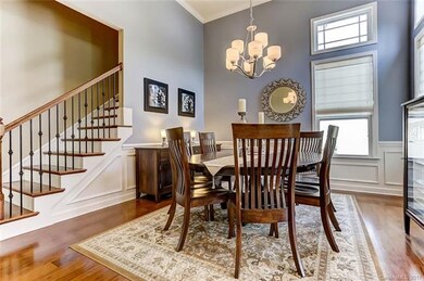 Formal Dining Room with Vaulted Ceiling, Wood Floo