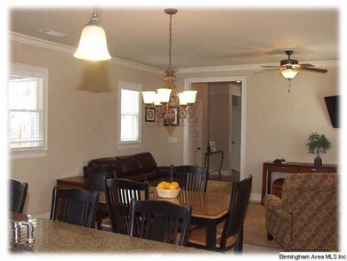 A view from the kitchen to the hallway that leads 