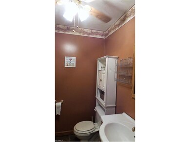 Half bath on main floor with ceiling fan.