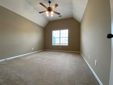 Carpeted spare room with lofted ceiling and ceilin
