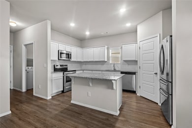 Wrap around Kitchen, Hall to Garage, and Laundry Room door.