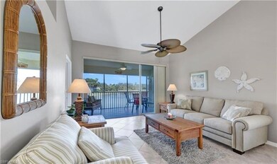 Living room with high vaulted ceiling, ceiling fan