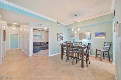 Dining space featuring custom light fixture and cr