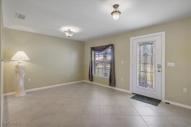 Foyer/Front Room with light tile patterned floors