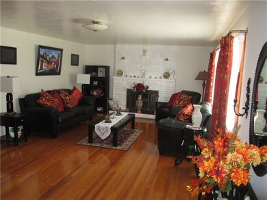 The living area is finished with hardwood flooring