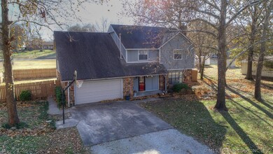 Front view of home and mature trees