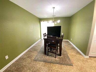 Dining area with baseboards and a chandelier