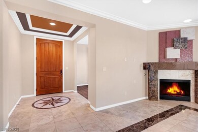 Great room with gas fireplace and crown molding th