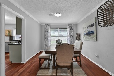 This inviting dining space is framed by a large wi