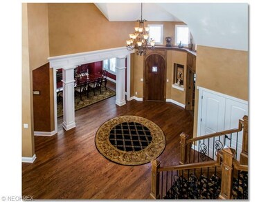 Inviting Two Story Foyer with Beautiful Hardwood F