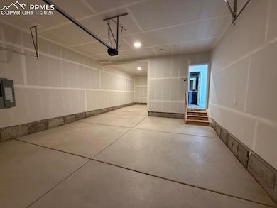 Garage featuring electric panel