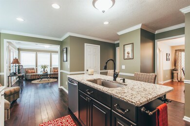 The kitchen openly connects to the dining room, Florida room & secondary stairwell to the bonus room.  