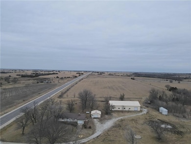 Birds eye view of property featuring a rural view