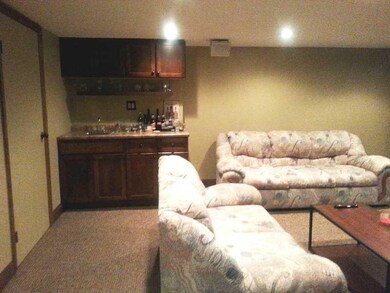 Family Room. Wet bar, wall to wall neutral carpeti