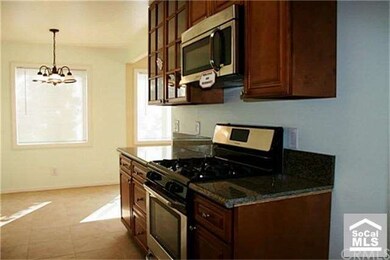Notice the kitchen is open to a dining area.