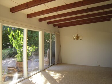 Dining area. Beam ceilings throughout