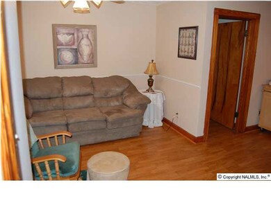 Open family room with new laminate wood floors!