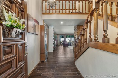 SPACIOUS ENTRY WITH LOW MAINTENANCE FAUX WOOD TILE