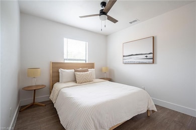 Bedroom featuring dark wood-type flooring and ceil