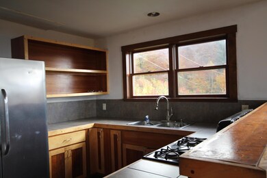 LOOKING EAST INTERIOR KITCHEN