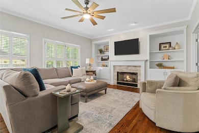 Perfect spot for gatherings - Cozy bright family room with gas fireplace and built-ins