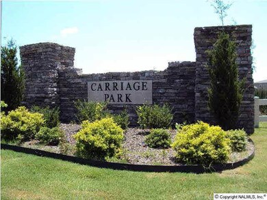 Entrance to subdivision is flanked by beautiful ponds with cat tails and white fencing.