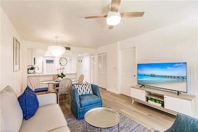 Living room with sink, ceiling fan with notable ch