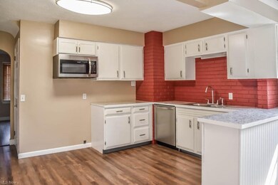 Updated kitchen with stainless steel appliances.