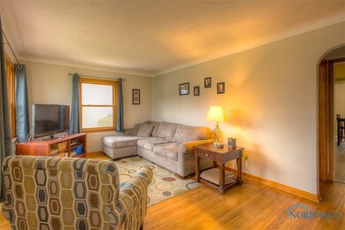 Neutral decor and hardwood floors throughout