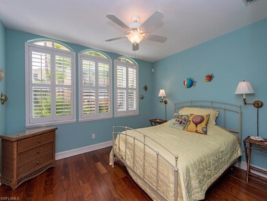 Plantation shutters and rich hardwood floors are i